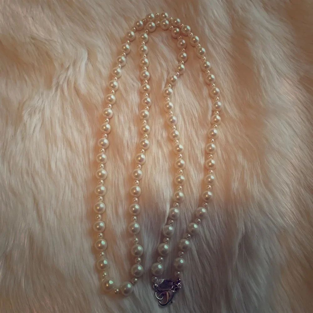 Long strand of Pearls by Chaps